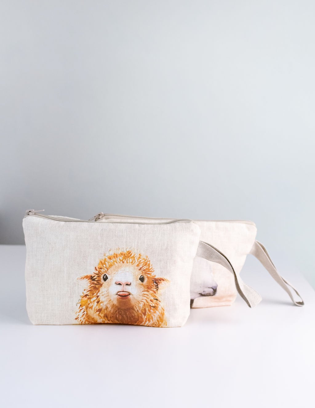 Wristlet pouch with knitter picture print on linen fabric